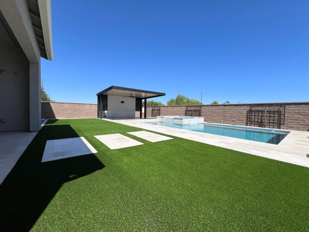 New Build Landscaping | Gilbert, AZ | artificial turf lawn and travertine paving 3